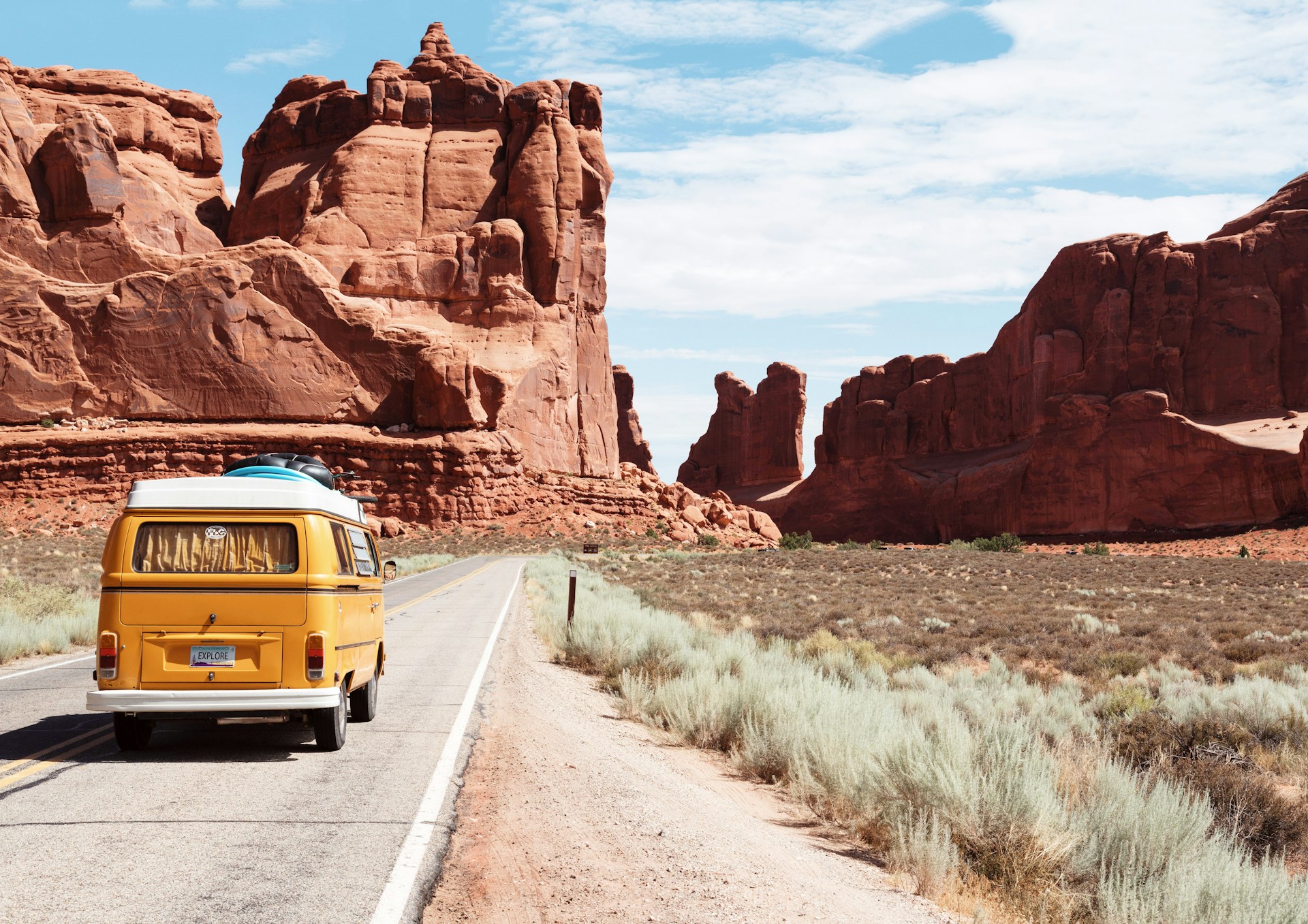 Open road through desert landscape